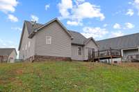 Back yard: offering Trex decking and patio with enhanced privacy as it backs up to a neighboring property situated on several acres