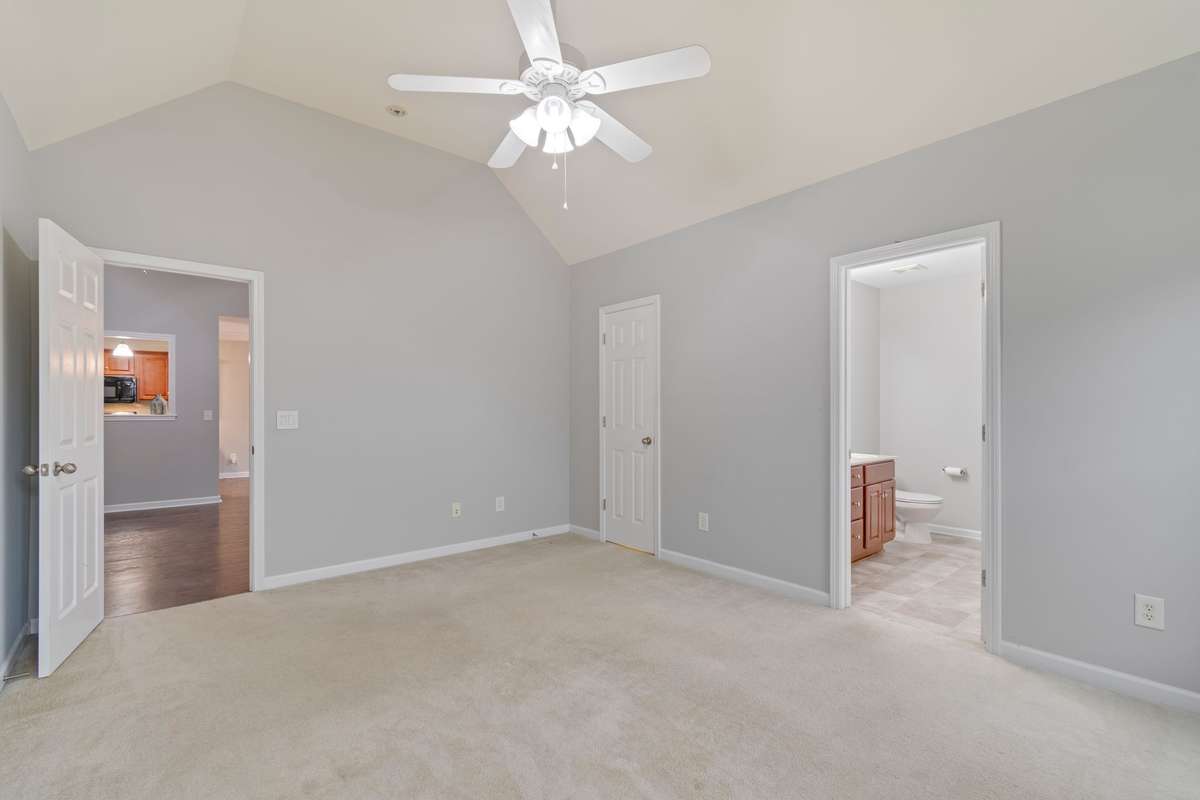 Primary Bedroom: Walk-in closet & full bath with soaker tub and double vanities
