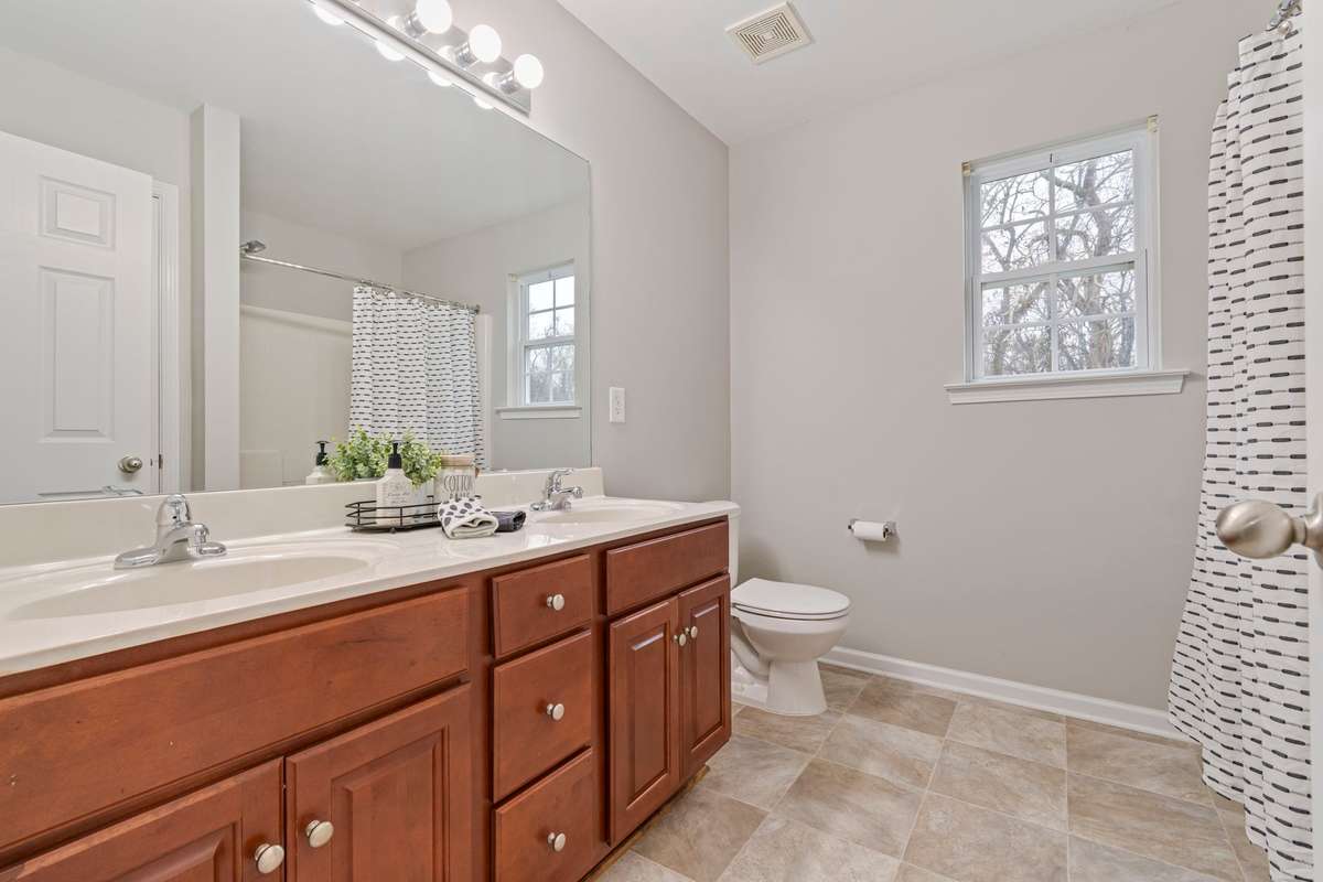 Primary Bedroom: Walk-in closet & full bath with soaker tub and double vanities