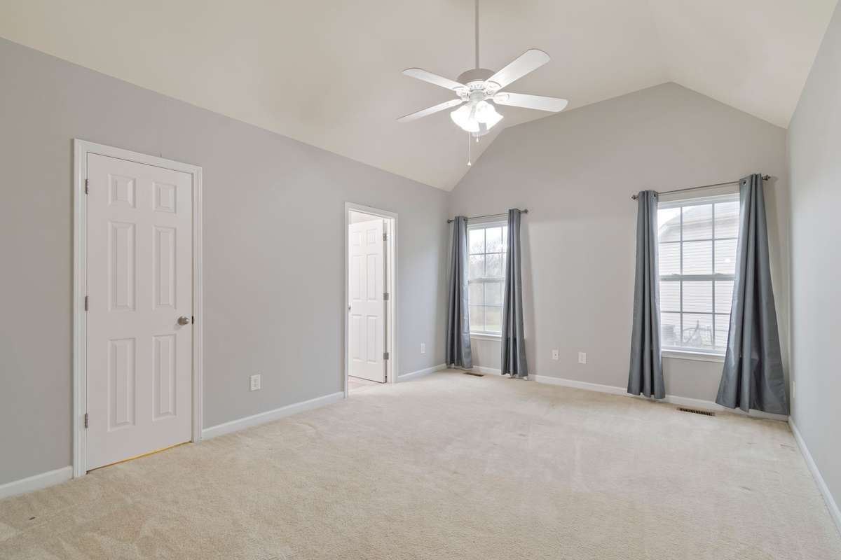 Primary Bedroom: Walk-in closet & full bath with soaker tub and double vanities