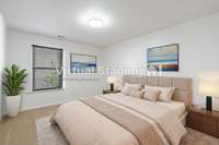 Virtually Staged ground floor guest bedroom has a large walk in closet.