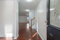 Entry foyer with traditional dining room to the left. Beautiful hardwood floors on main level.