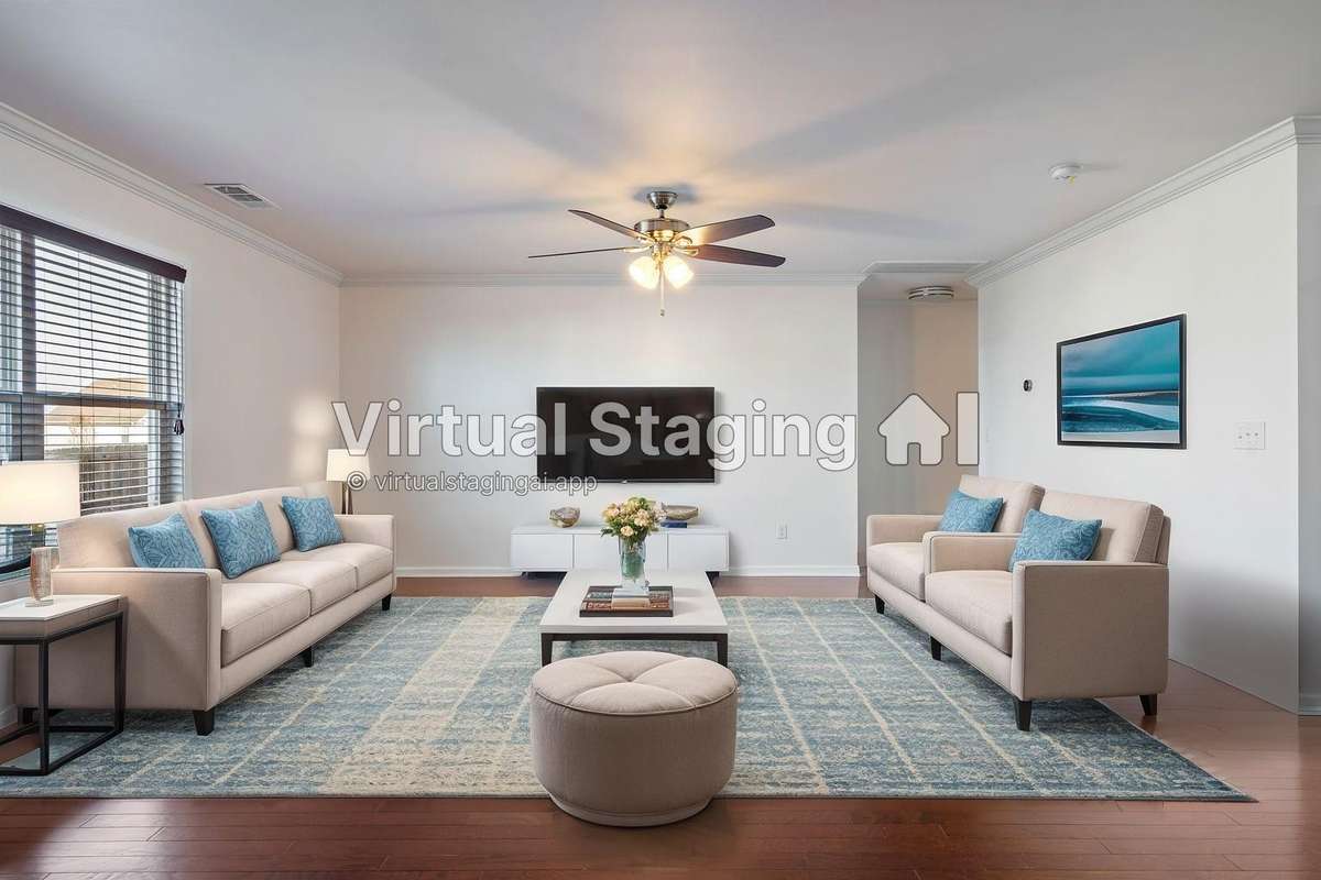 Virtually staged living room that is open to the kitchen.  Door on the right leads to a ground floor guest suite with a large walk in closet.