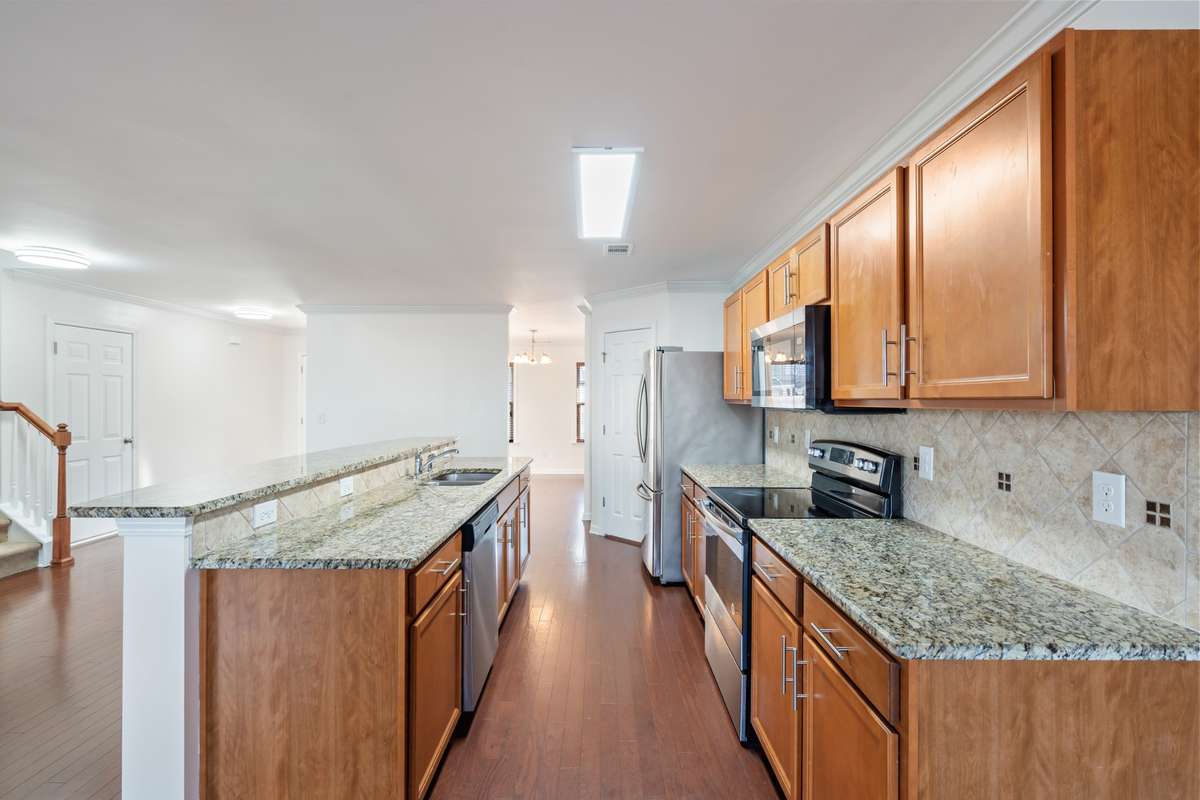 Stainless, granite and hardwood!  New, updated faucet coming soon.