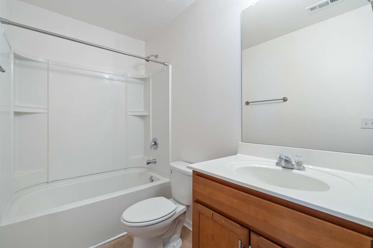 This full bathroom is conveniently located right off the living room and outside of the guest bedroom door. New updated sink faucet coming soon.