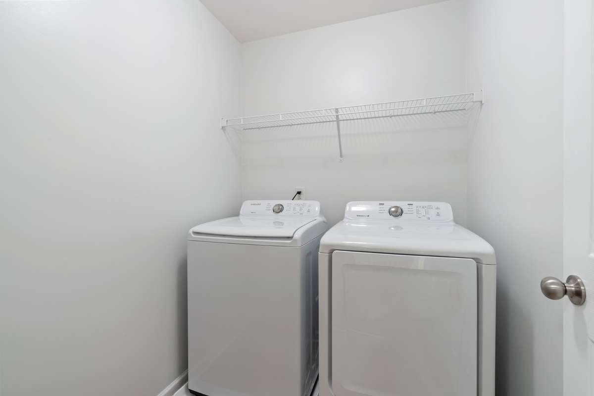 Laundry located on second floor with bedrooms for convenience.