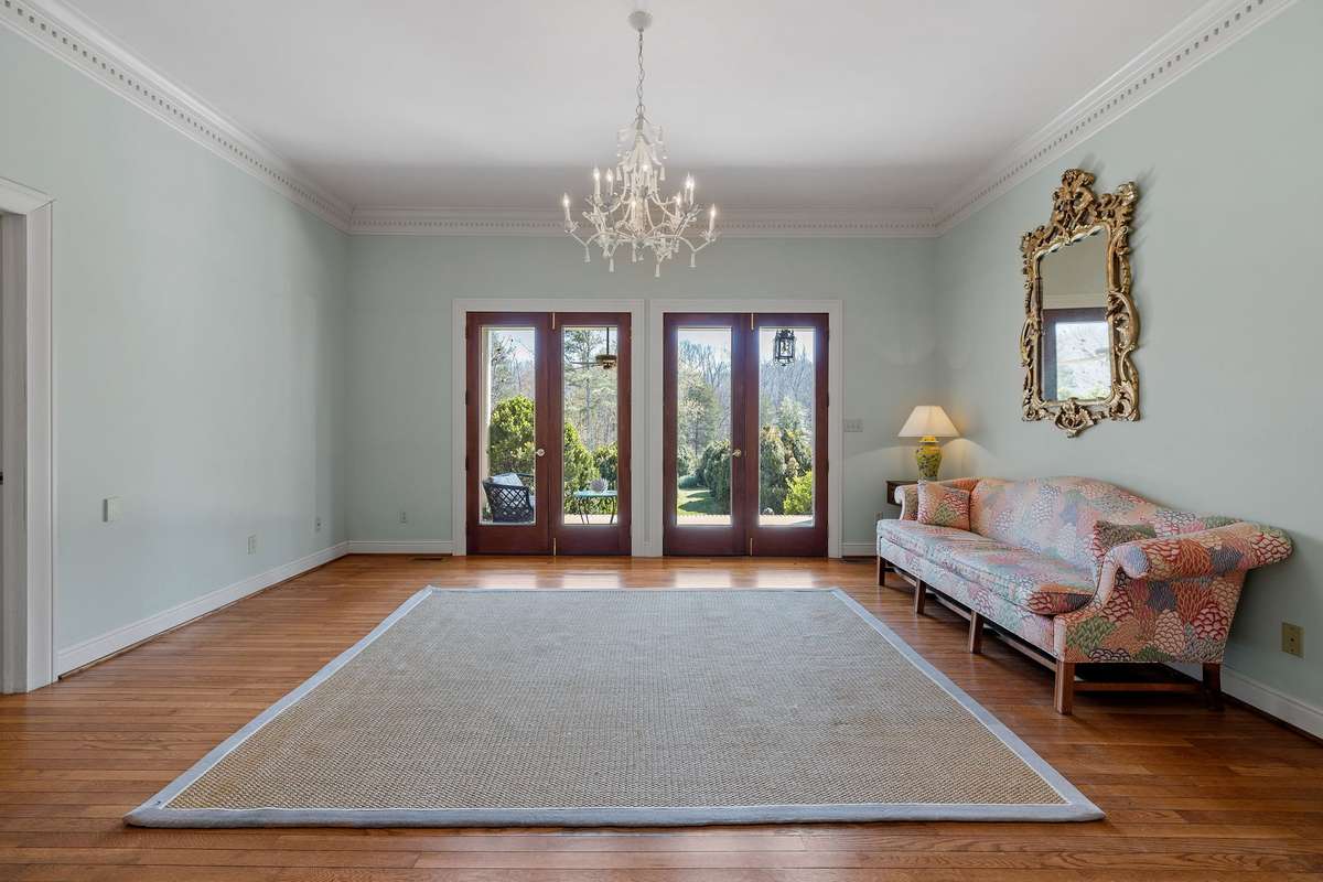 Doors in Den open onto the porch