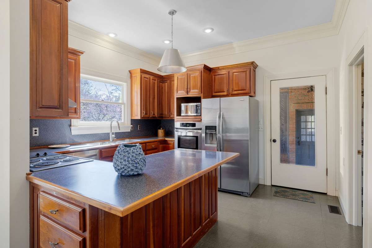 Kitchen with door exiting to the breezeway