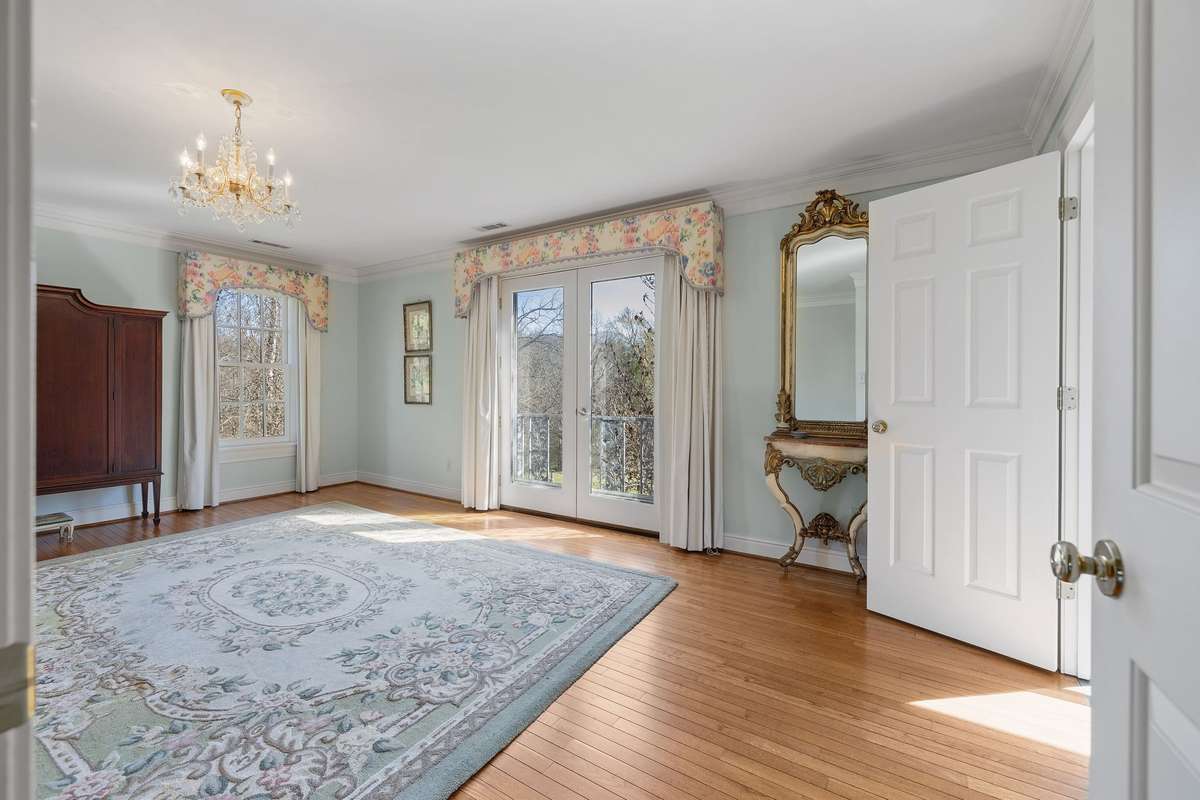Both primary bedrooms have a view of Shoal Creek