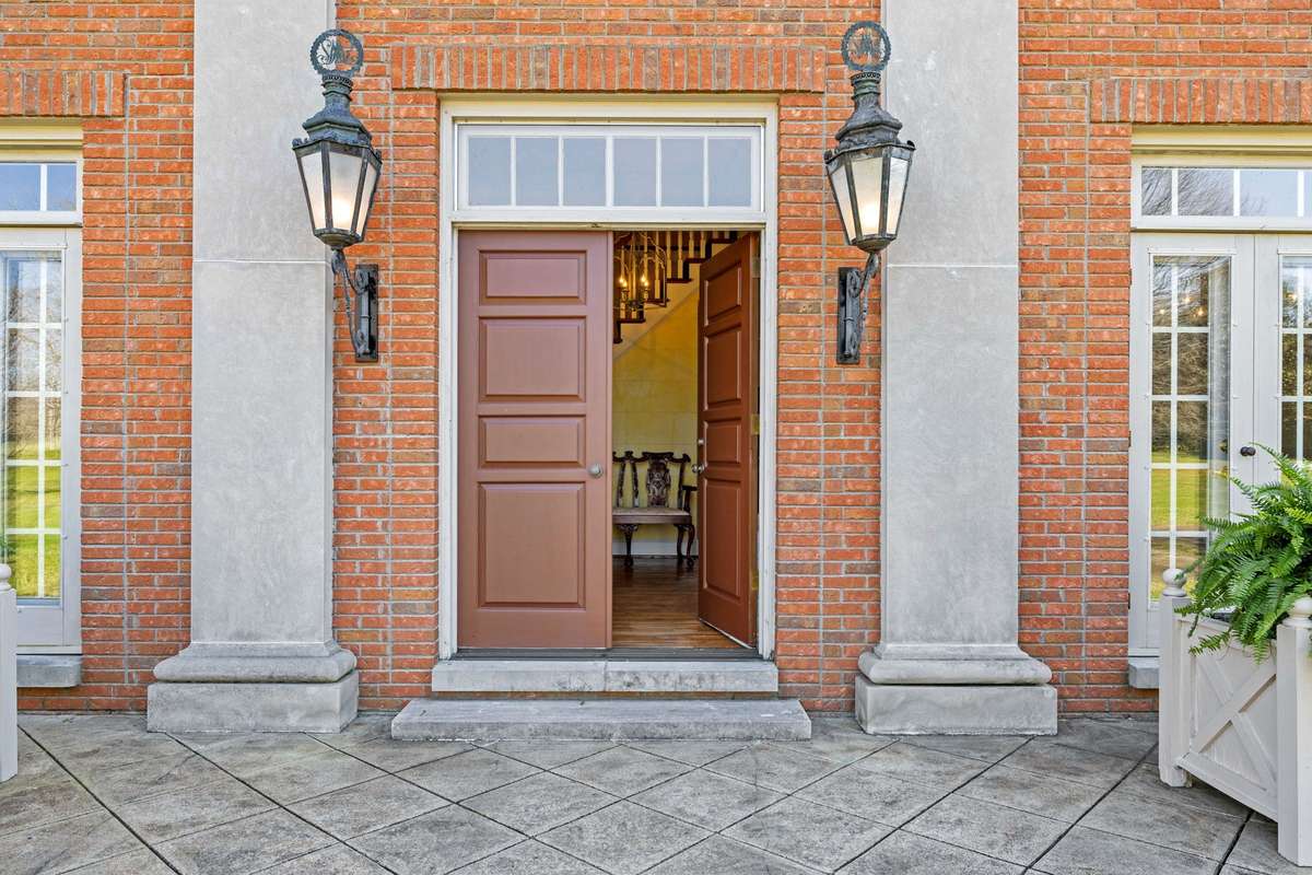 Hand-hewn limestone pilasters adorn the front facade