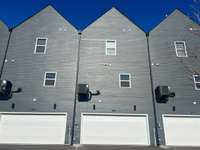 The AC unit is mounted (one for unit with 3 thermostats).  The 2 car garage has been converted into a gameroom but there is plenty of street parking for guests.