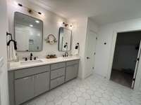 3rd Fl. Primary Full Bath with linen closet and walk-in closet and quartz countertops.