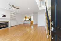 Step inside to a large great room with soaring 15' foyer to the right and fireplace on the left.
