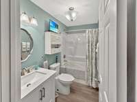 Spare bathroom featuring a jetted tub