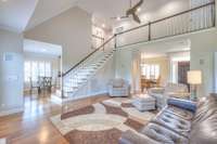 Living room with a bright airy feel from soaring ceilings