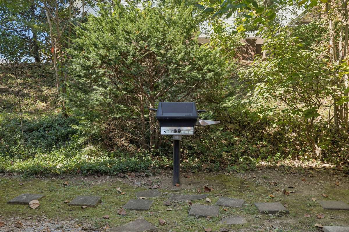 There is a shared grill for homeowners in Building "N", and conveniently located right by this home! Here's a good view of the trees behind the unit which provides for some privacy!