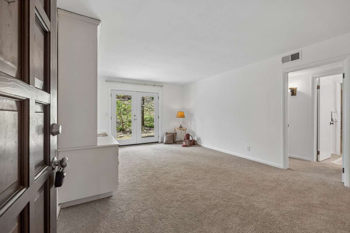 Walk in to the Living/Dining combination room with new french door, carpet and paint!