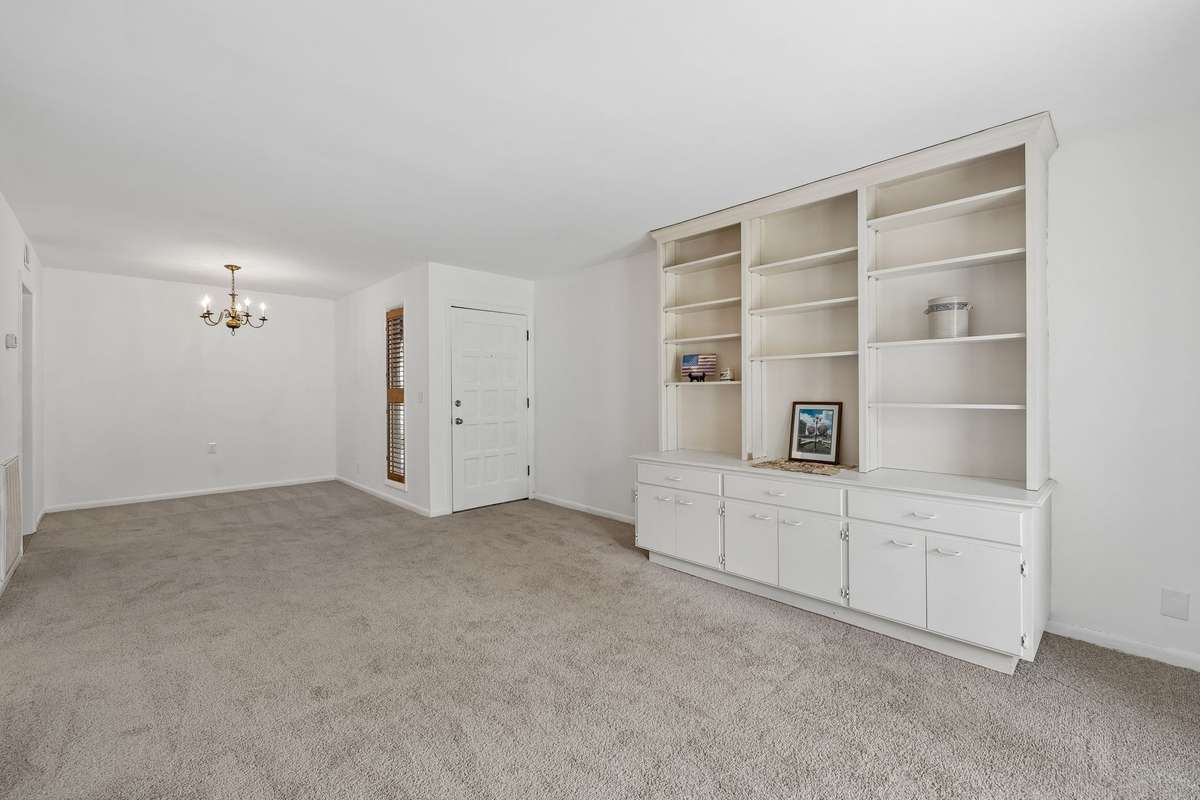 In this picture, you can see the Dining area next to the window with the Plantation Blind near the front door!