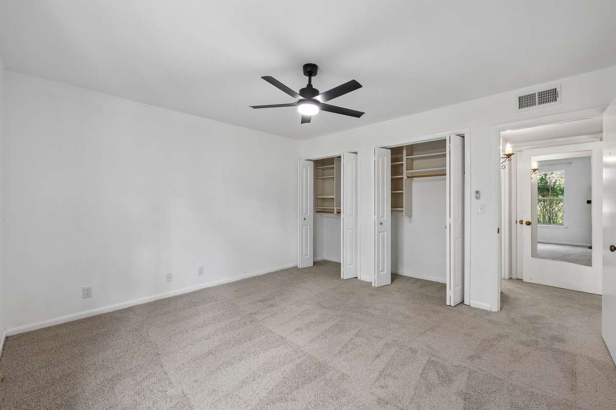 The Bedroom has new carpet,  ceiling fan/light & closet doors offering plenty of storage!
