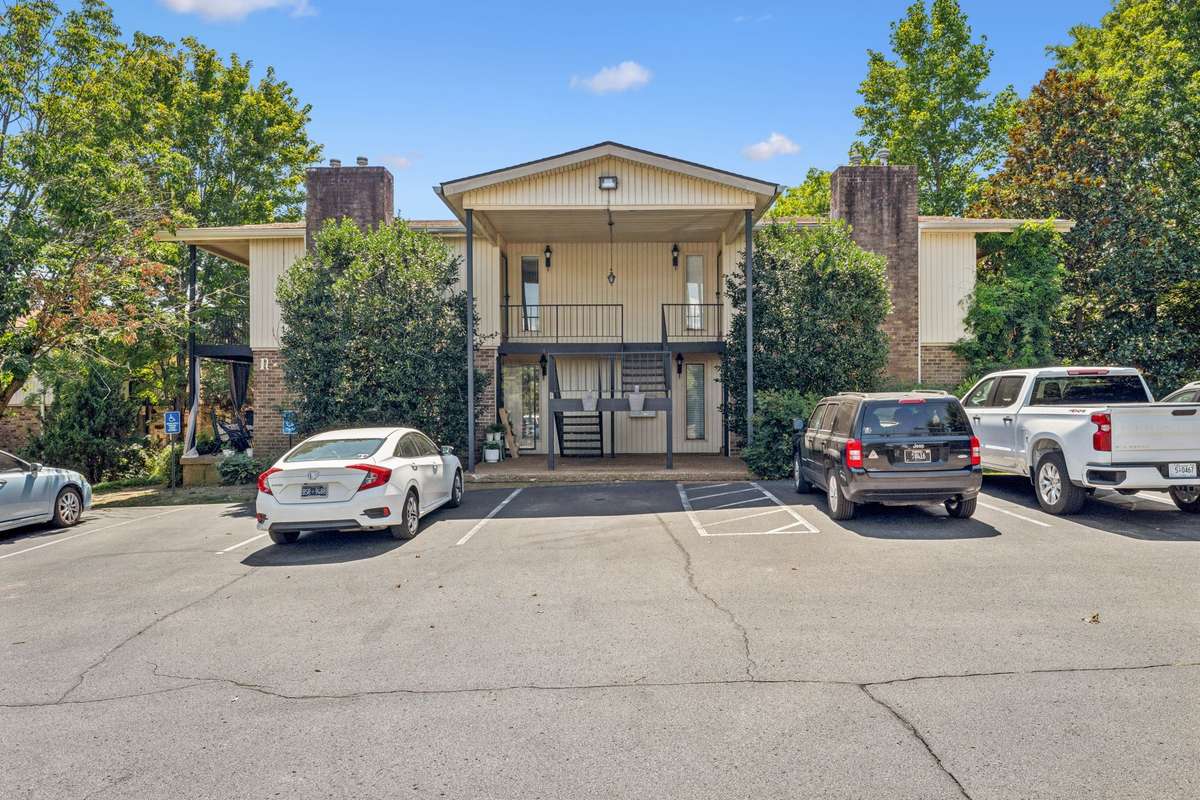 When you enter Hobbs House, go straight until you see the shrubs and must make a right or left turn - go left up a small incline (hill). This is the view you will see, the sidewalk is on the left side, take the 1st turn to the right to Unit #11.