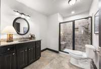 The 4th full bath in the basement with tile shower!