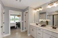 Photos are of the model home. Listing is for a to be built home. Primary Bathroom!