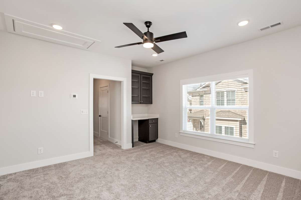 Picture is of the Madison Americana built on another lot. You can add a wet/dry bar to this plan in the bonus room to really complete the perfect game room or bonus set up.