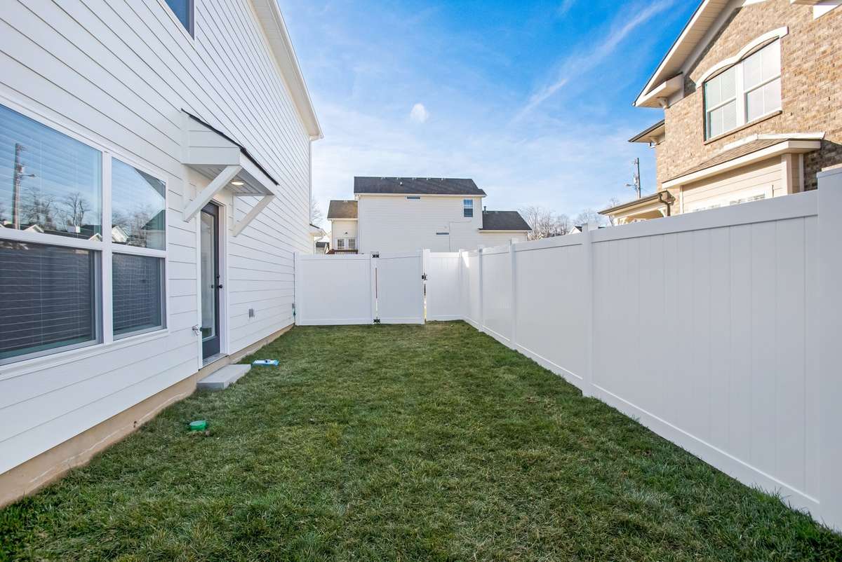 Picture is of the Madison Americana built on another lot.  Lot sizes vary but they all come standard with  privacy fences and full sod and irrigation.