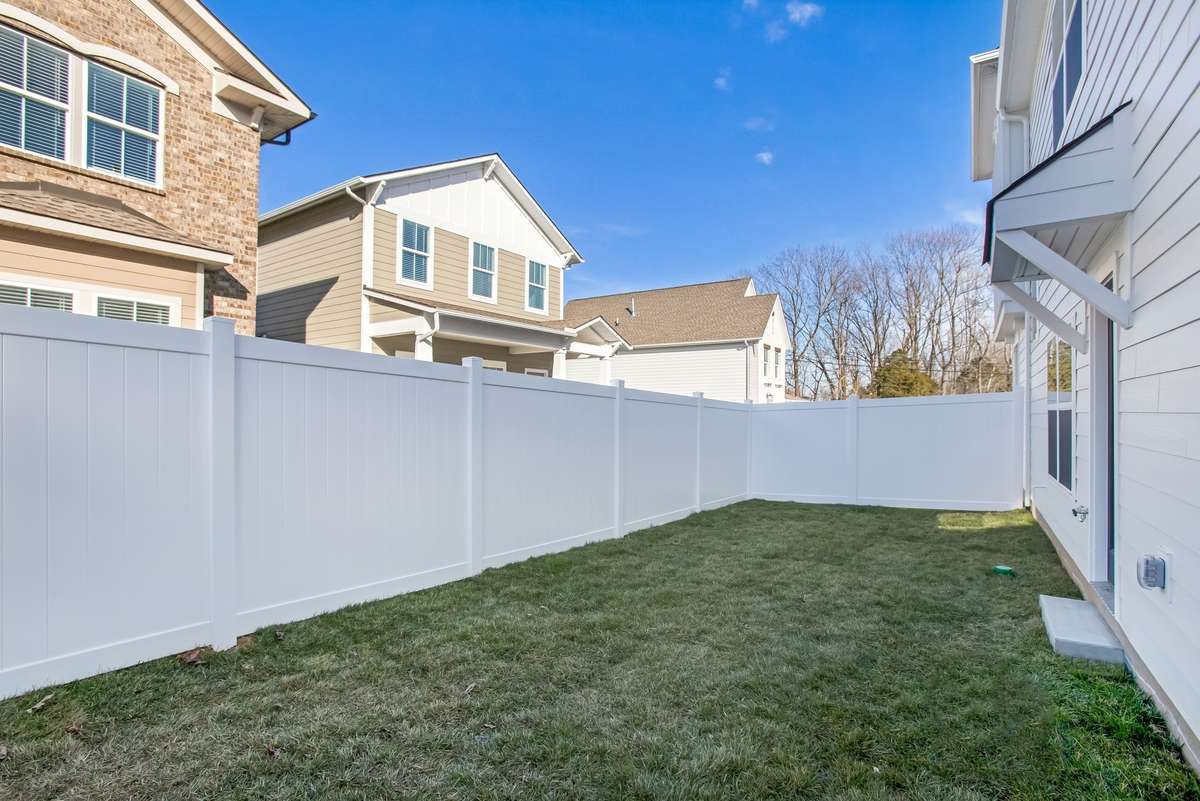 Picture is of the Madison Americana built on another lot.  Lot sizes vary but they all come standard with  privacy fences and full sod and irrigation. 10x10 concrete patio added!