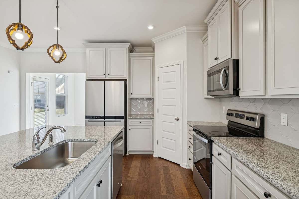 Refrigerator, stove, microwave, and dishwasher stay with the house