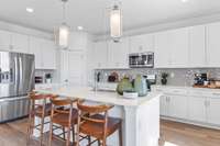 This is a photo of one of our model homes. Please know that some of the exterior and interior finishes, paint, and features may vary.