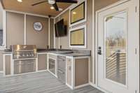 Built in gas grill. To the right side is a 2 drawer beverage or snack fridge. All granite countertops, the floors a re TREX, they will last forever.