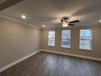 Great Room  THIS PHOTO IS OF A PREVIOUSLY BUILT SIMILAR PROPERTY. THE FINISHES IN THIS UNIT MAY DIFFER.