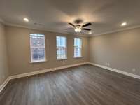 Great Room THIS PHOTO IS OF A PREVIOUSLY BUILT SIMILAR PROPERTY. THE FINISHES IN THIS UNIT MAY DIFFER.