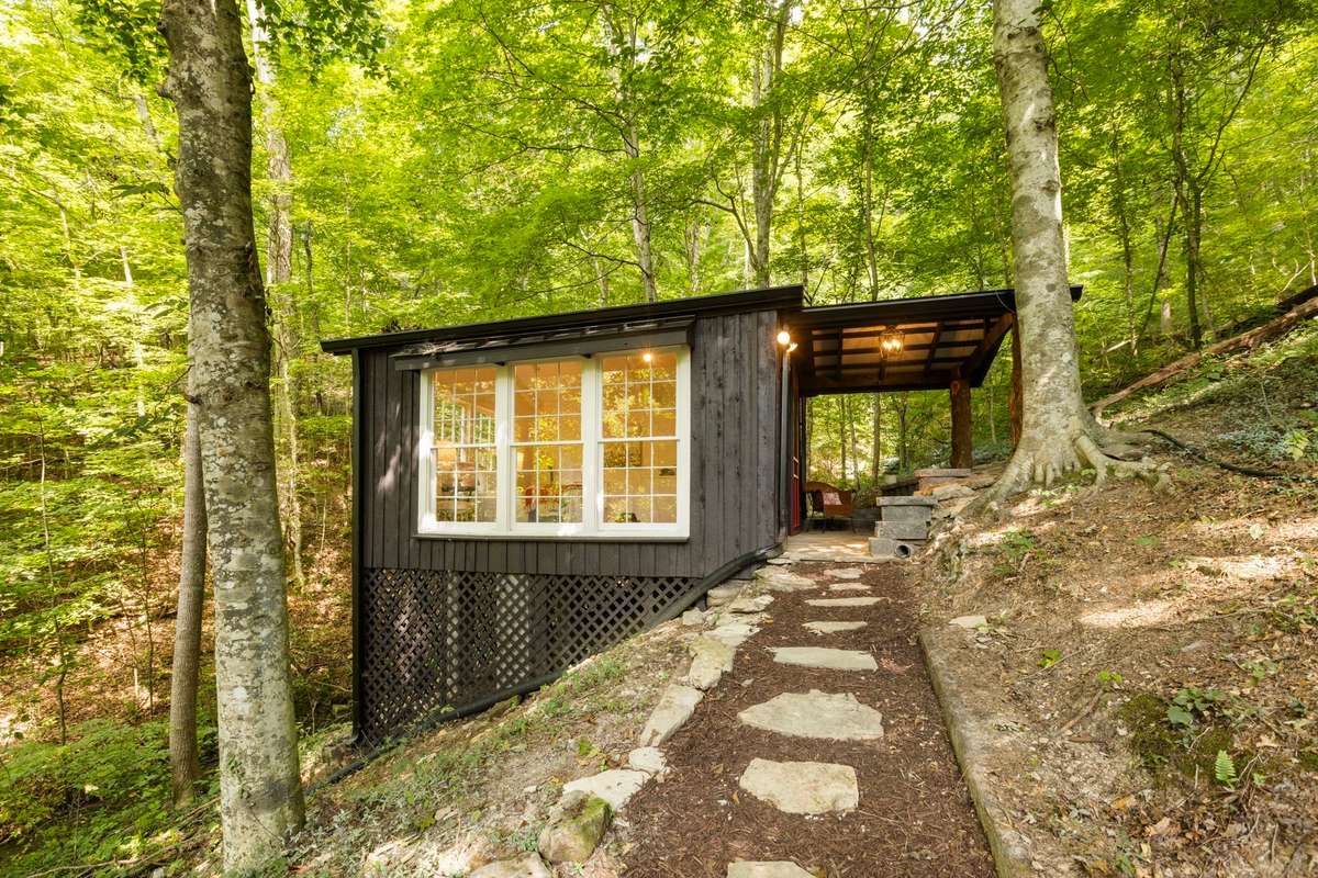 The studio/sleeping cottage is steps away from the main cabin. The walkway is lined in stone steps.