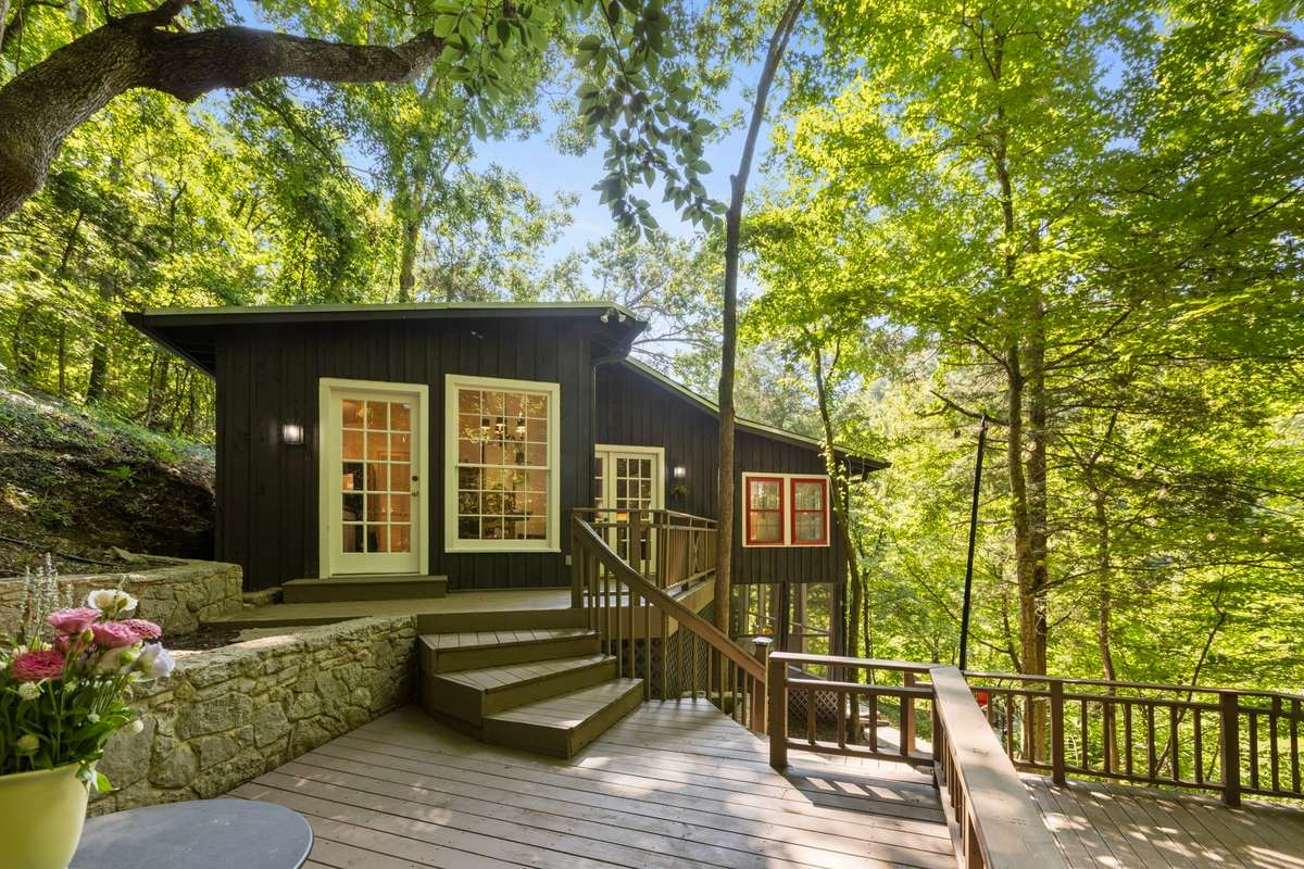 This view is of the main cabin. Straight ahead is the door to the kitchen and the front door is to the right.  How Charming is this!