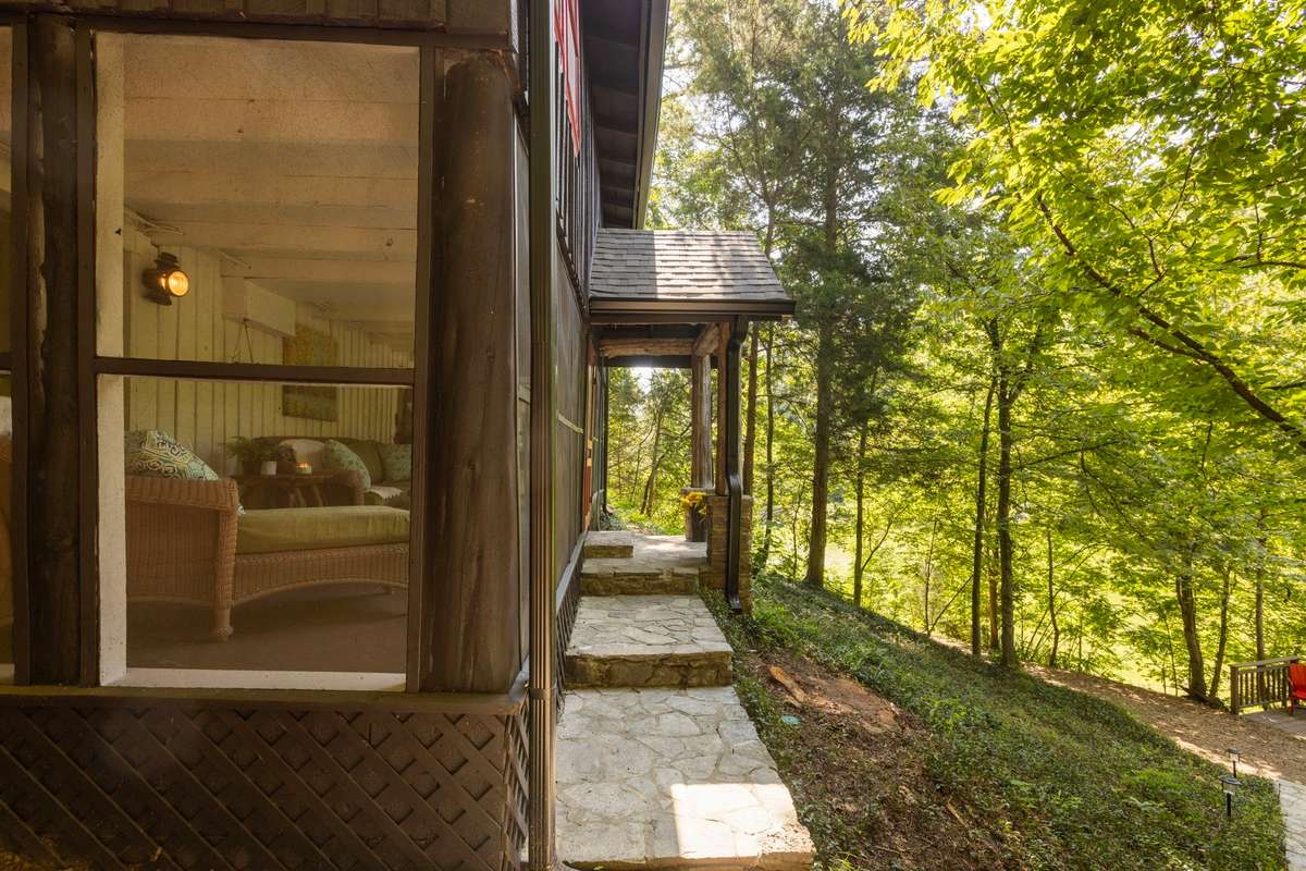 A screened in porch is perfectly perched with lake views year-round.