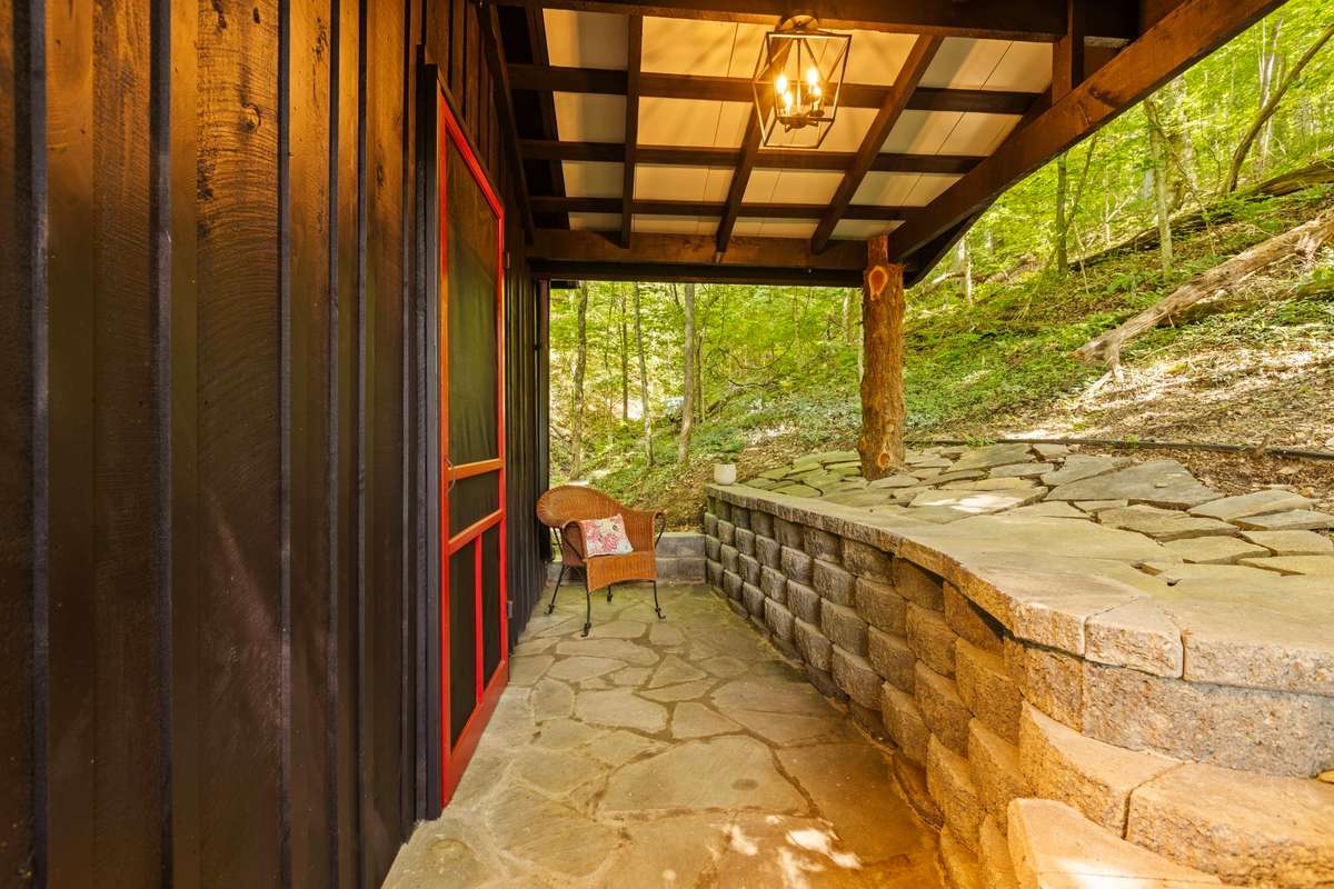 A new porch was added with a retaining wall!  A perfect place to bird watch or take in the morning breeze.