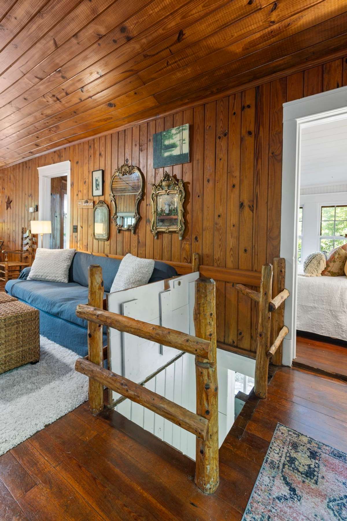 An adorable winding staircase leads to the screen porch. When not needed it makes a great dog bed enclosure.