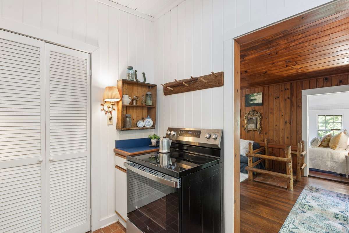 Behind these double doors is a large pantry with loads of shelves for can goods, treasures and supplies.