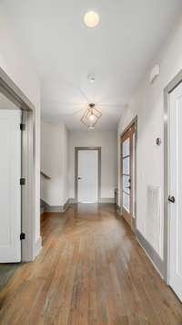 The hallway takes you to the 2nd & 3rd bedroom along with the full bathroom & laundry room on the 2nd level.