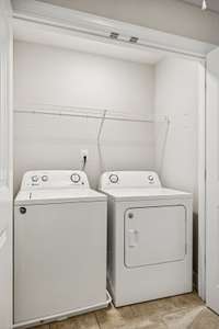 Laundry closet conveniently located in the hallway between both upstairs bedrooms—ideal for daily ease and accessibility.