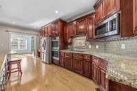 Kitchen looking into a large eat in area or great office