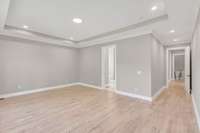 another view of the airy primary bedroom