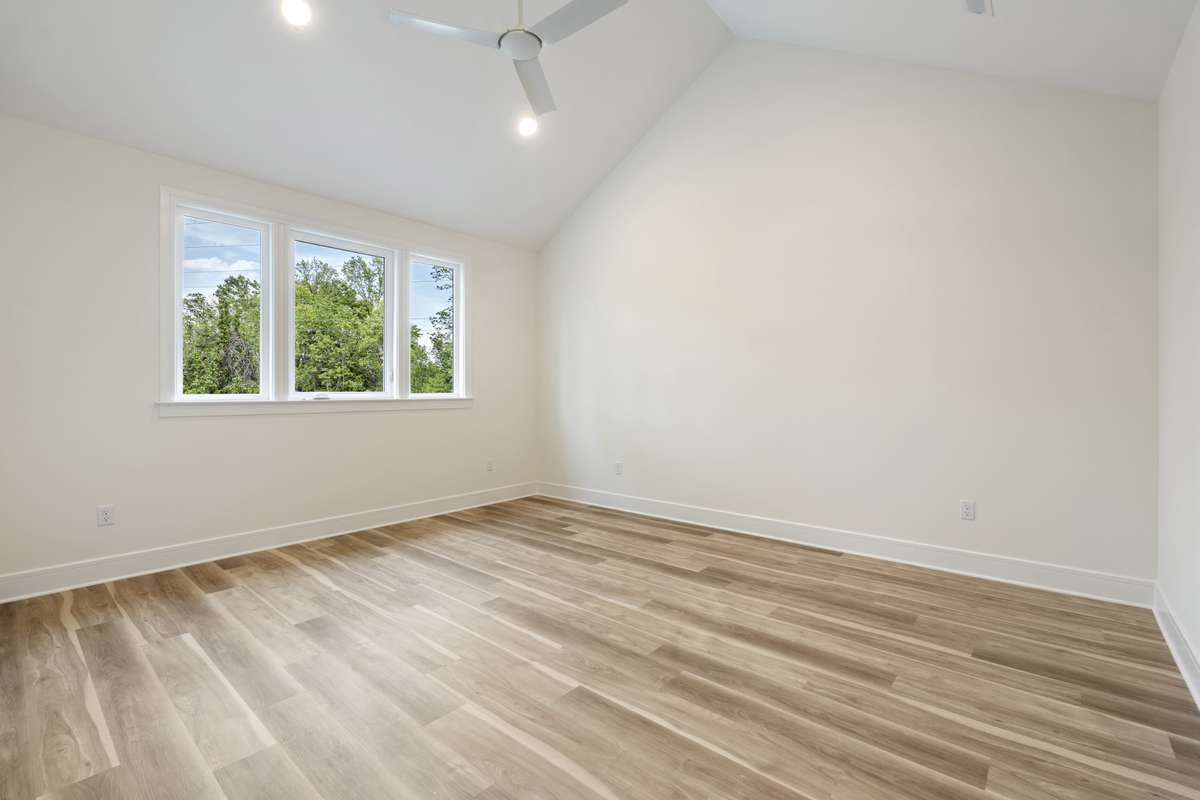 Primary bedroom. Also with vaulted ceiling