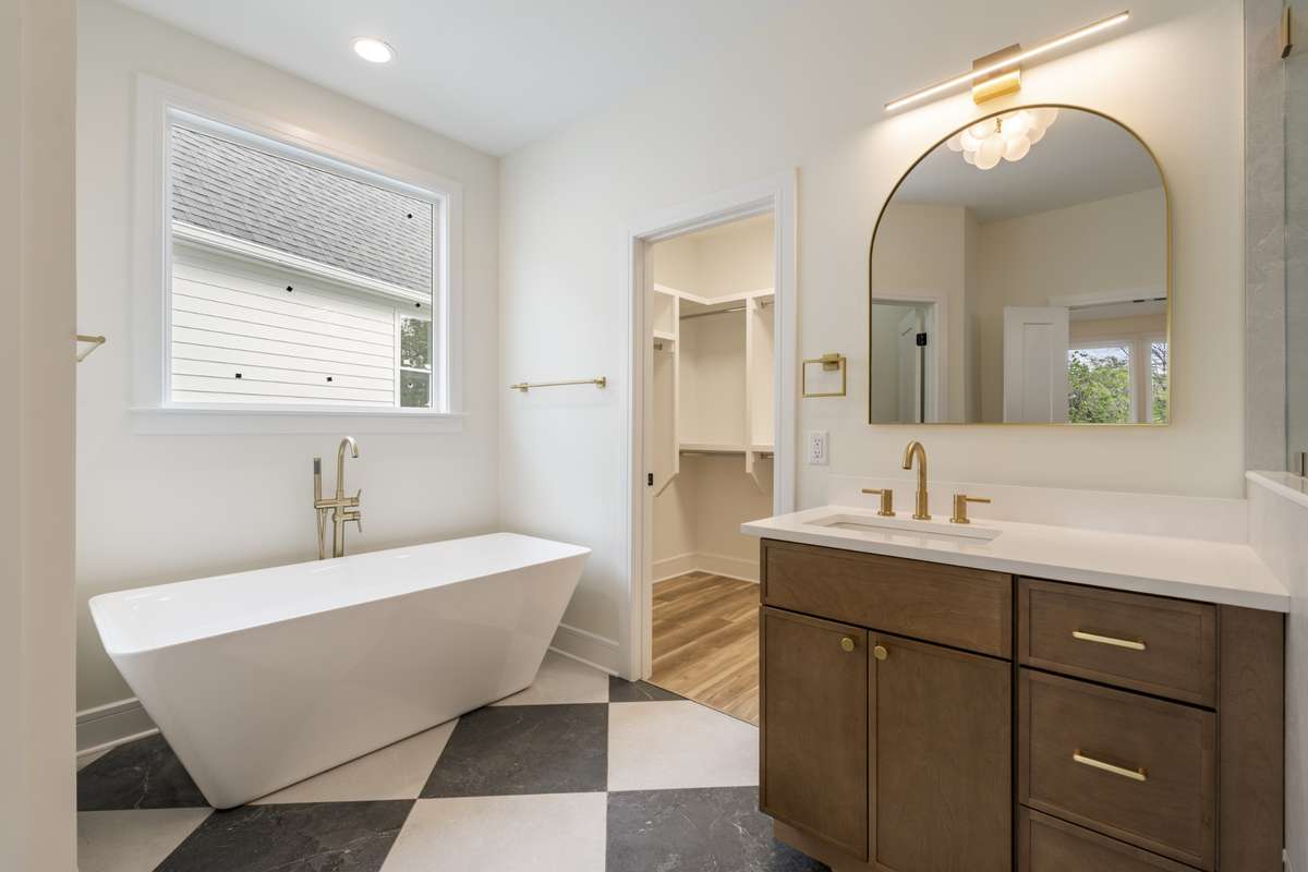 The primary comes complete with a private water closet as well as a soaking tub