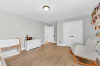 Double Door closet & Wood flooring continued into secondary bedrooms