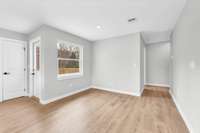 This shows the dining area open to the kitchen and living room