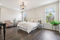 Primary bedroom with two windows, recessed lights, & farmhouse light fixture. 549 Montrose Dr. Mt. Juliet, TN 37122