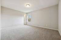 Second bedroom with carpet flooring, neutral color scheme, & window. 549 Montrose Dr. Mt. Juliet, TN 37122